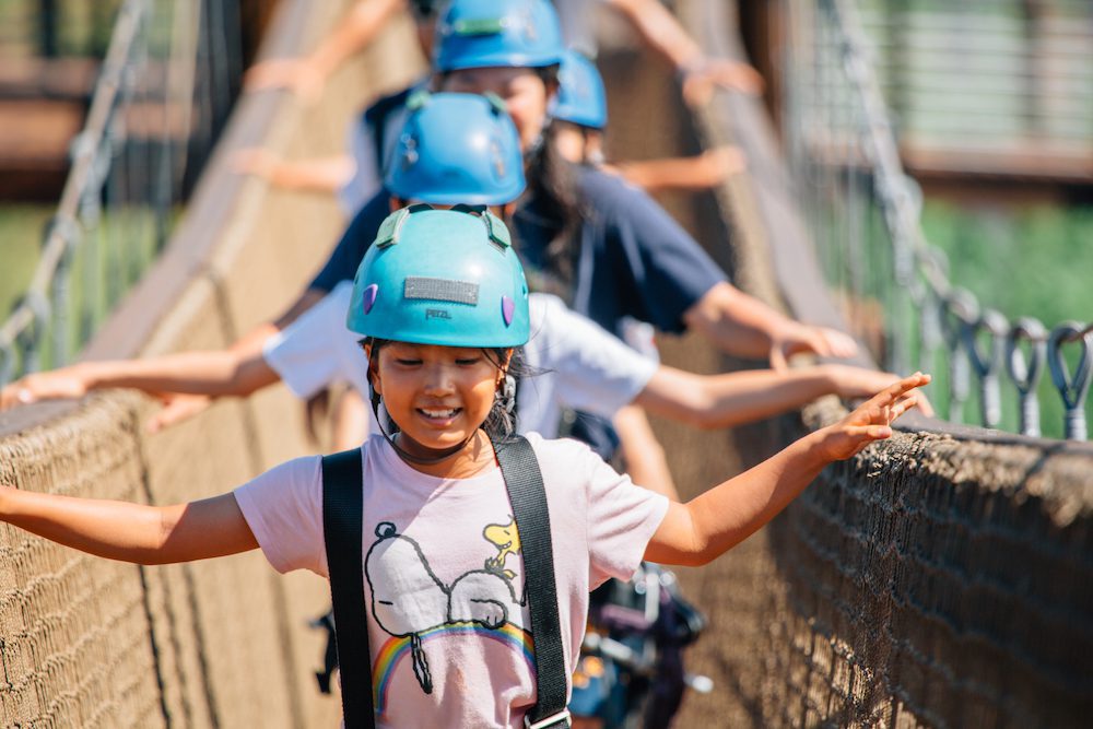 kids crossing bridge Oahu kids on Oahu zipline tour