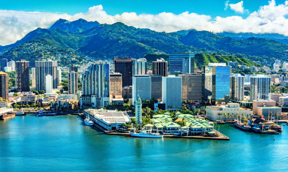 aerial shot of Honolulu, Oahu, with mountains in the background