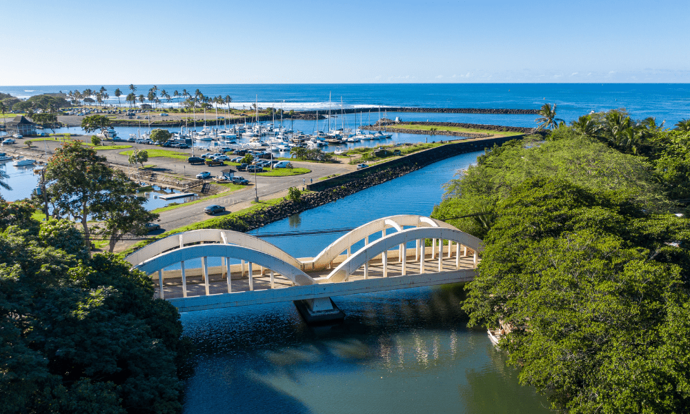 photo of the bridge near haleiwa town, oahu, looking out towards the ocean and marina